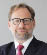 A man wearing a suit and tie. Description generated by AI