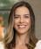 A woman with long hair and a white shirt. Description generated by AI