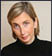 A woman wearing a black and white striped shirt. Description generated by AI