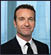 A man wearing a suit and tie. Description generated by AI